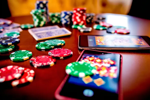 A cheerful woman in traditional clothing using her smartphone during a festive moment, showing how easily the 8777BET app fits into everyday life.